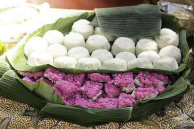 Ketan kepel is a traditional indonesian food that is round in shape and served when it's still fresh
