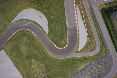 High angle view of road amidst grass in city