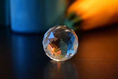 Close-up of crystal ball on table