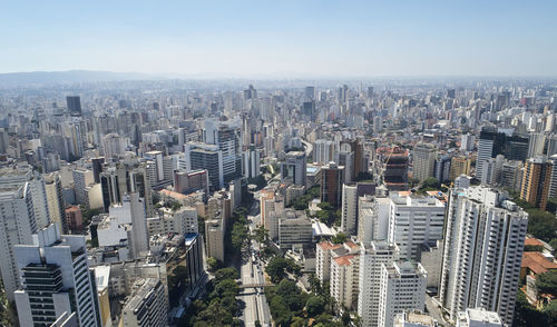 High angle view of modern buildings in city against sky