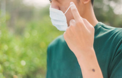 Midsection of woman holding hands