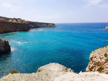Scenic view of sea against blue sky