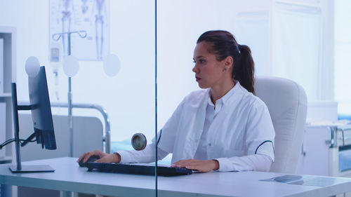 Female doctor working at clinic