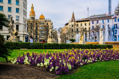 Panoramic view of buildings against cloudy sky