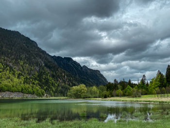 Scenic view of lake and mountains against cloudy sky at dreiseengebiet, bavaria