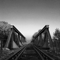 Railroad tracks against clear sky