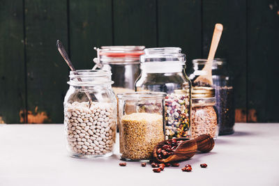 Close-up of beer in glass jar on table