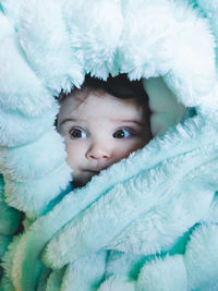 Close-up portrait of cute baby lying down