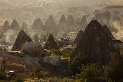 High angle view of rock formations in foggy weather