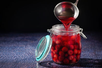 Close-up of drink in glass jar on table