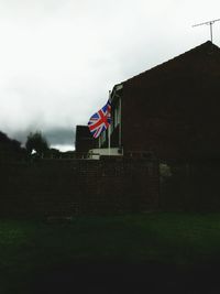 Low angle view of flag against sky