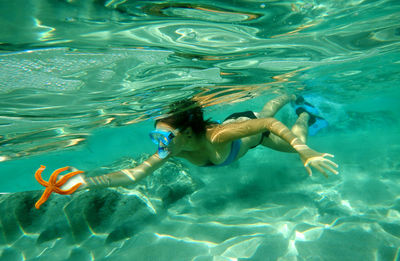 Woman swimming underwater