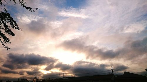 Low angle view of cloudy sky at sunset