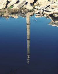 Building reflecting in water