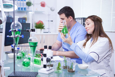 Female friends working in laboratory