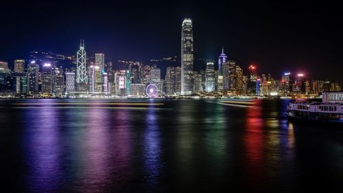 Illuminated city at waterfront