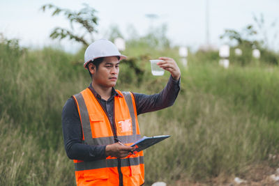 Marine biologist analysing water test results and algea samples