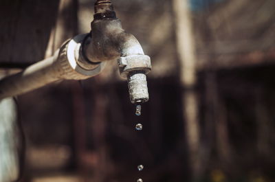 Close-up of water falling from faucet