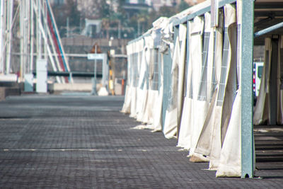 Clothes drying on footpath by street