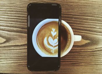 Close-up of cappuccino on table