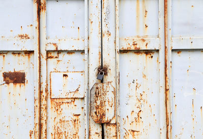 Full frame shot of locked old metallic door