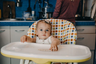 Baby feeding. best finger foods for toddler babies. toddler baby girl with crispbread, 