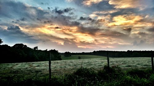 Scenic view of landscape against cloudy sky