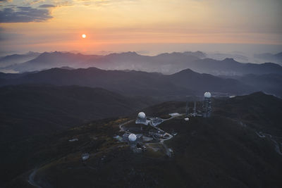 High angle view of mountains against sky during sunset