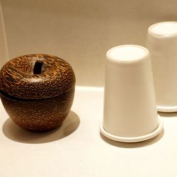 High angle view of tea cup on table against white wall