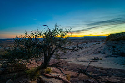 Scenic view of land against sky during sunset