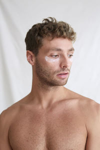 Portrait of handsome young man over white background