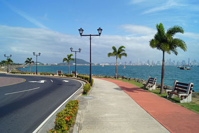 Street by sea against sky