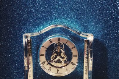 High angle view of clock on table