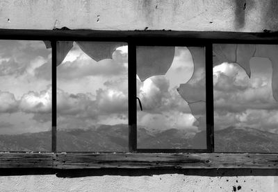 Cloudy sky seen through glass window