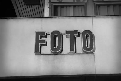 Low angle view of text on wall of building