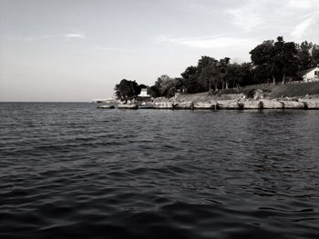 Scenic view of sea against cloudy sky