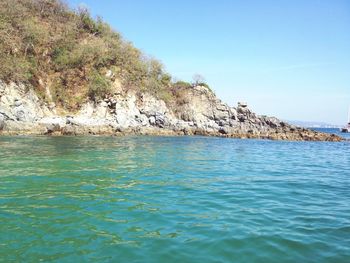 Scenic view of sea against clear blue sky