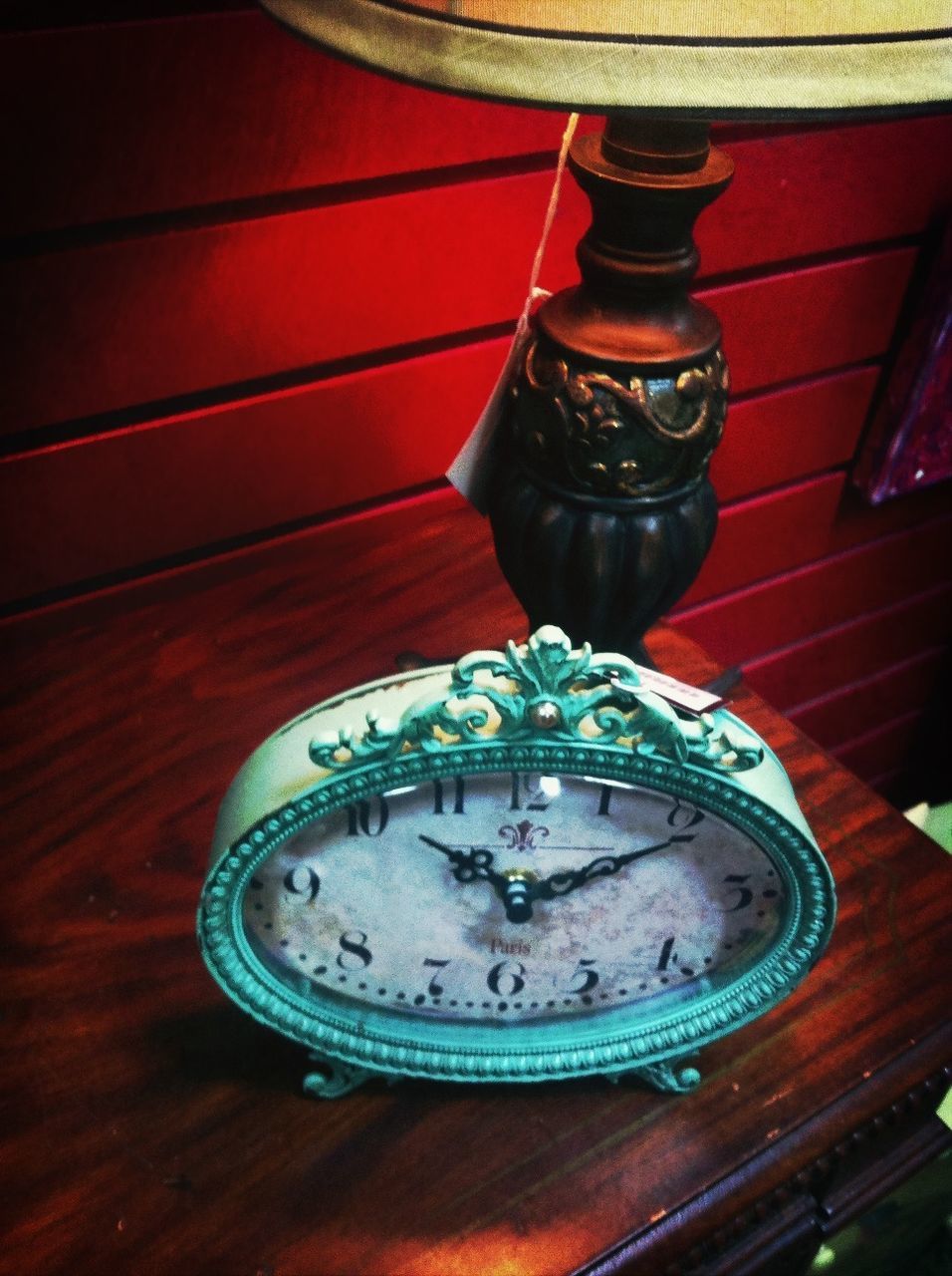 indoors, table, wood - material, still life, red, high angle view, close-up, no people, single object, design, circle, lantern, wooden, decoration, metal, illuminated, old-fashioned, wall - building feature, antique, ornate