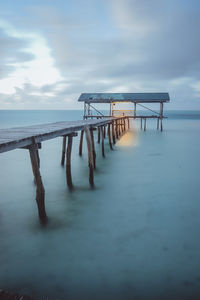 Pier on sea against sky