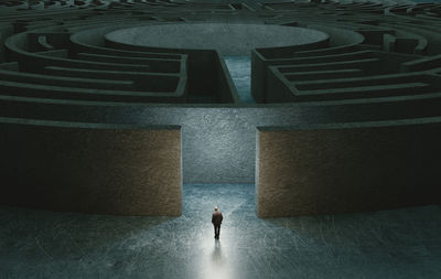 High angle view of man walking in maze