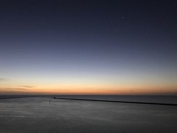 Scenic view of sea against sky at sunset