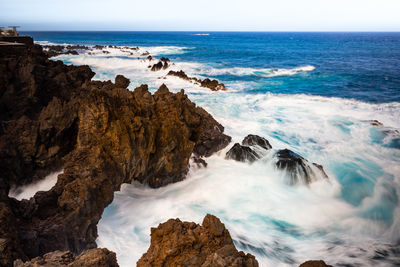 Panoramic view of sea and rocks - porto moniz - madeira island 