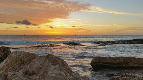 Scenic view of sea at sunset