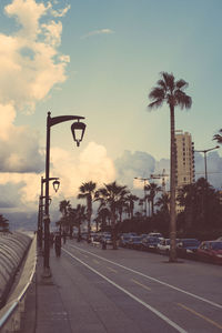 View of empty road against cloudy sky