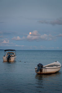 Boat in sea against sky