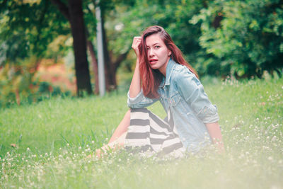 Portrait of beautiful woman on field