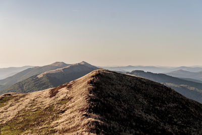 Scenic view of mountain range against clear sky