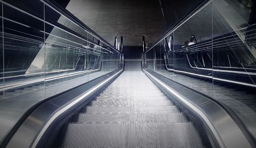 Illuminated escalator at subway station