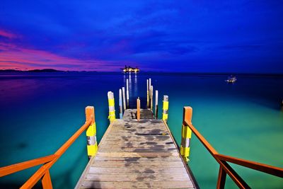 Jetty leading to calm sea