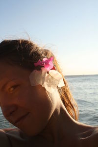 Close-up of woman holding plant